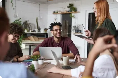 Meeting of a work team led by a boy with glasses